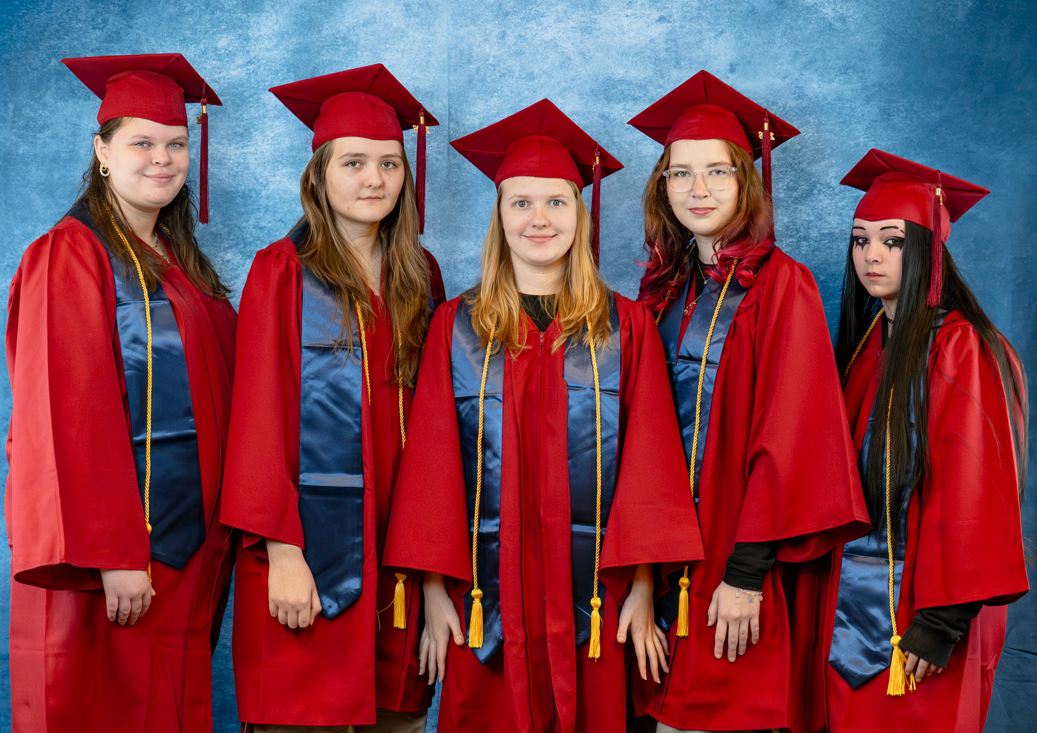 BCA graduates in caps and gowns celebrating commencement